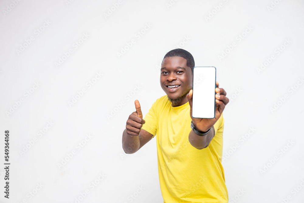 handsome Young African man holding smartphone mockup of blank screen and shows ok sign on white background handsome Young African man holding smartphone mockup of blank screen and shows ok sign on white background