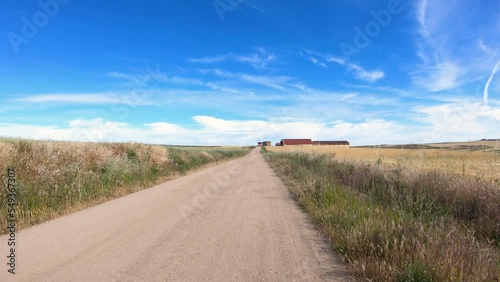 Camino de Madrid - dirt road on a summer landscape after Zamarramala, municipality of Segovia, Castile and León, Spain photo