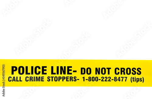 Yellow police tape with text: police line do not cross, call crime stoppers , lower third position, isolated on white background