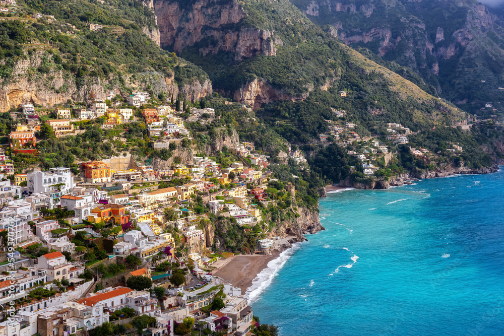 Touristic Town, Positano, on Rocky Cliffs and Mountain Landscape by the Tyrrhenian Sea. Amalfi Coast, Italy. Touristic Town, Positano, on Rocky Cliffs and Mountain Landscape by the Tyrrhenian Sea. Amalfi Coast, Italy.