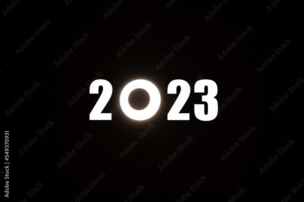 2023 text on a black background where instead of zero the LED lamp is round, Happy new year 2023 on a black