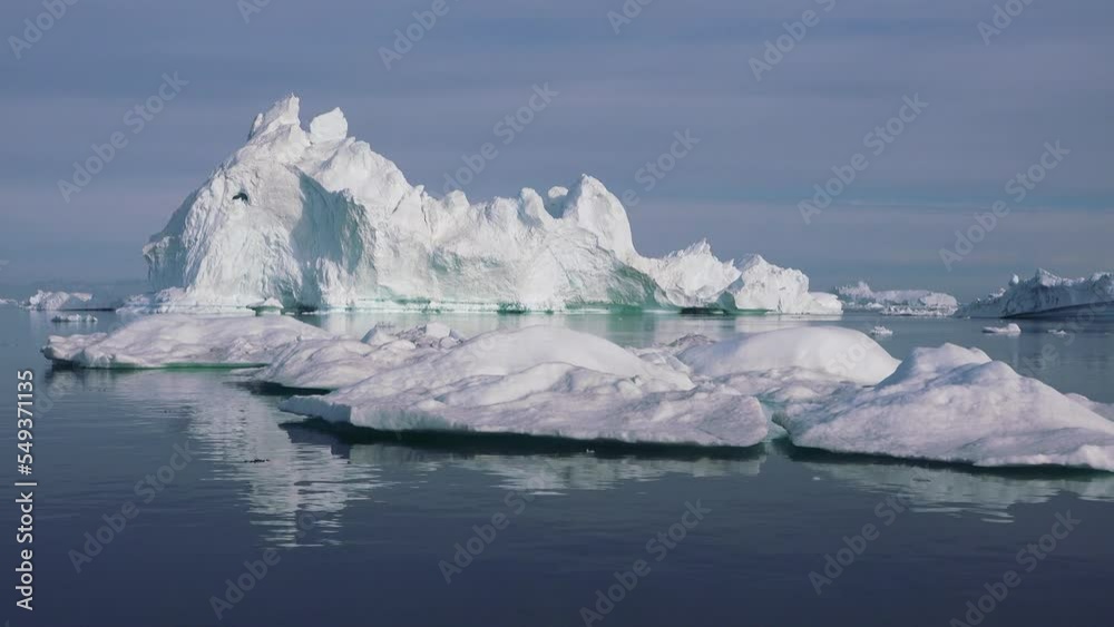 Expedition sailing close to icebergs, Antarctica. The ship sails through the sea ice in the winter, close-up. Expedition sailing close to icebergs, Antarctica. The ship sails through the sea ice in the winter, close-up.