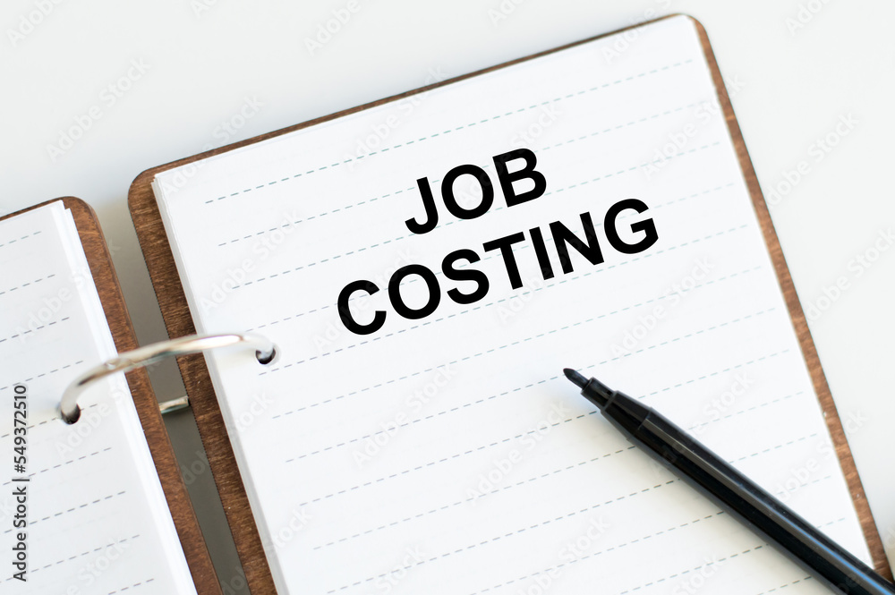 JOB COSTING text on a sticky note on a cork board with pencil , JOB COSTING text on a sticky note on a cork board with pencil ,