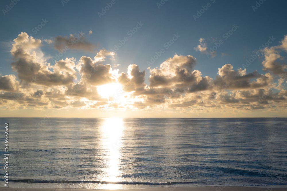 Obraz premium Sunrise sea on tropical beach. Landscape of beautiful beach. Beautiful sunset at sea. Ocean sunset on sky background with colorful clouds. Sunset over calm sea with beautiful sky.