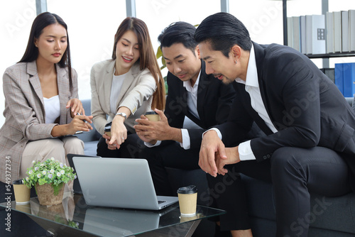 Business people relax meeting in office by using laptop computer and discussion or brainstorming