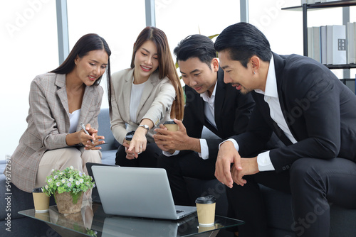 Business people relax meeting in office by using laptop computer and discussion or brainstorming
