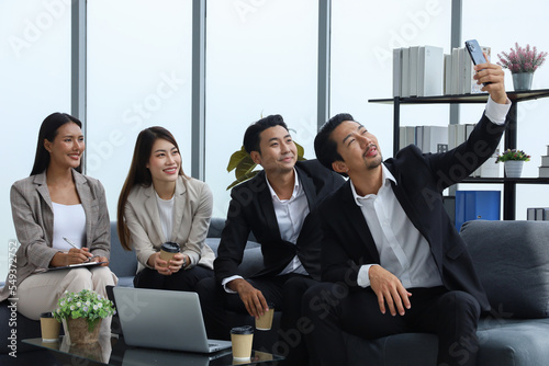 Business people relax meeting in office and selfie picture with team