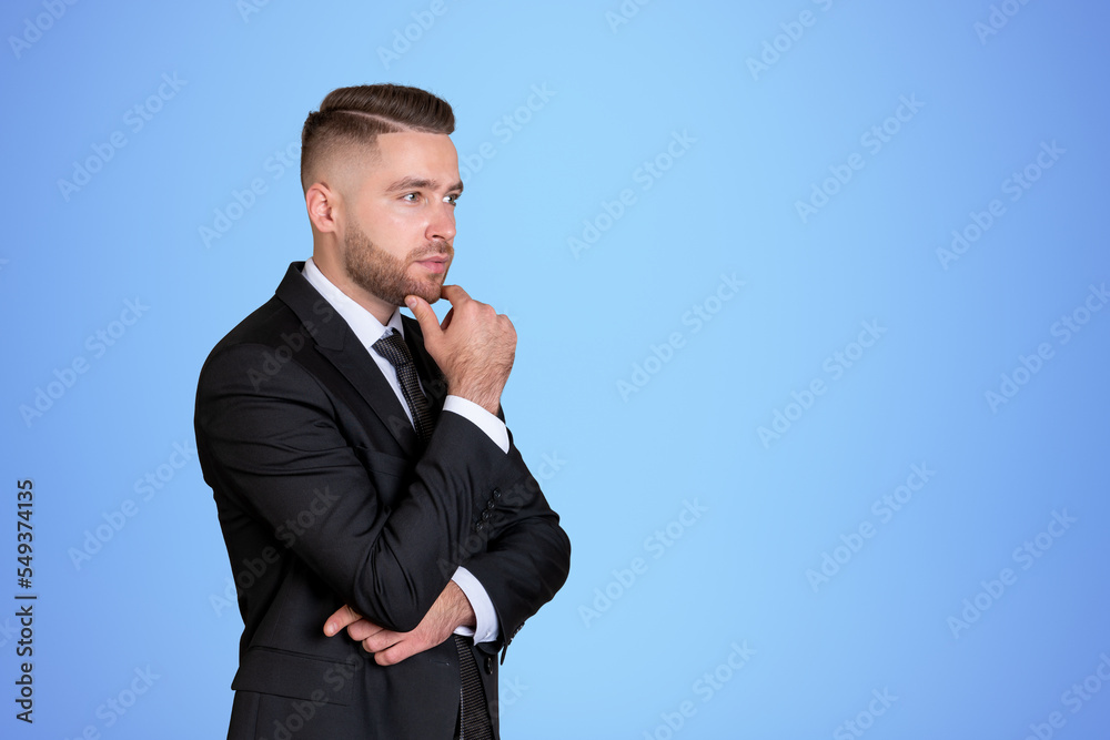 Attentive handsome businessman wearing formal wear standing touc Attentive handsome businessman wearing formal wear standing touc