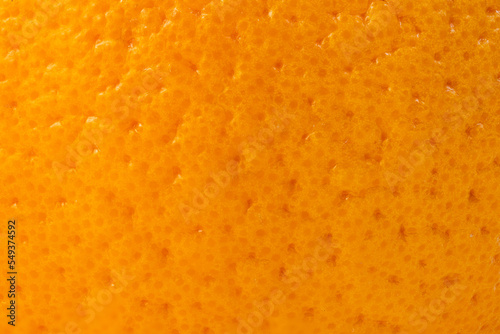 Ripe orange peel macro close up background