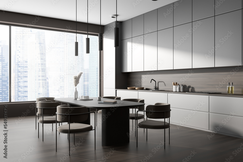 Corner view on dark kitchen room interior with panoramic window Corner view on dark kitchen room interior with panoramic window