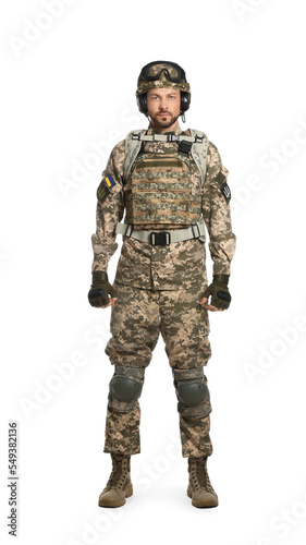 Soldier in Ukrainian military uniform with tactical goggles and headphones on white background