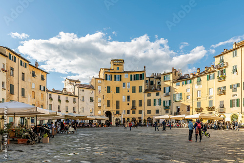 The central Piazza Anfiteatro square in Lucca, Italy, on a sunny day