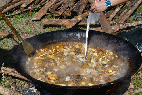 tradisional curry  that is being cooked photo