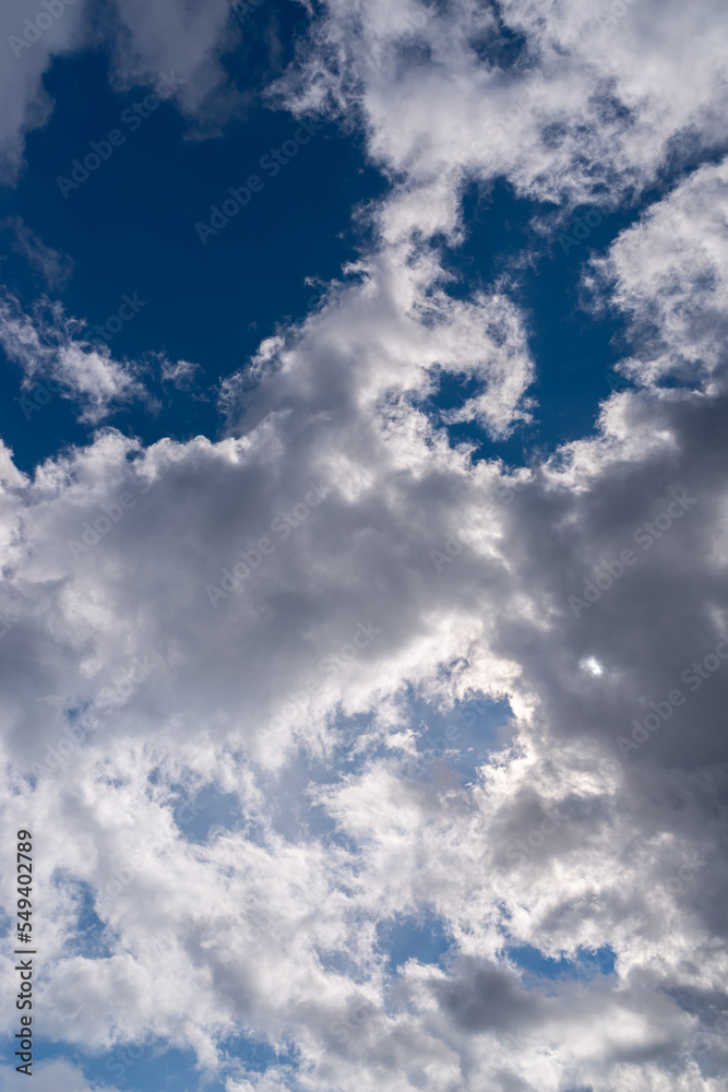 Obraz premium Dramatic blue sky with white clouds.