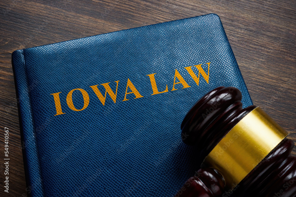 Iowa law book and gavel on the table. Iowa law book and gavel on the table.