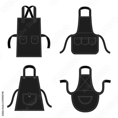 Black kitchens aprons of different shapes with pockets. Professional uniform for chef. Protective accessory