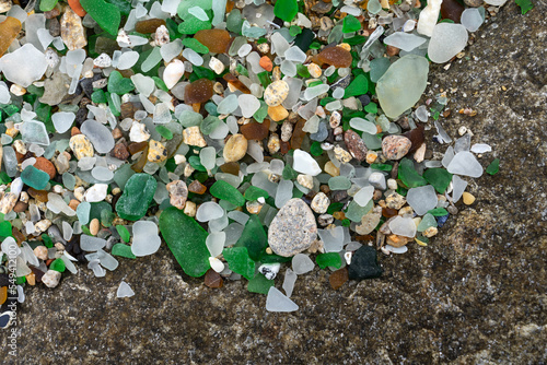 Colored crystals eroded by the sea in the beach of the crystals in the silleiro cape in Pontevedra photo