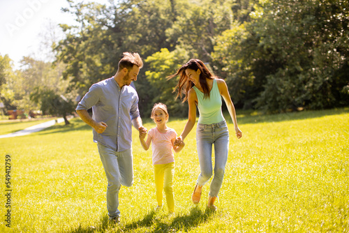 Happy young family with cut...