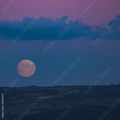 Moonrise over Broadway Tower, Cotswolds, Worcestershire. Taken from Bredon hill photo
