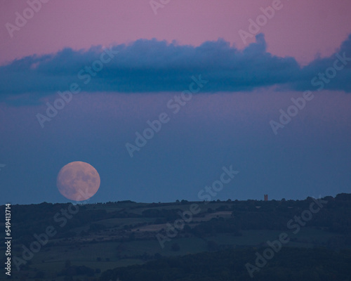 Moonrise over Broadway Tower, Cotswolds, Worcestershire. Taken from Bredon hill photo
