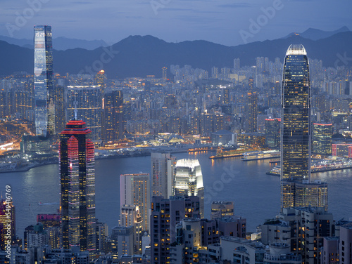 Photography Blue hour landscape of Hong Kong Harbour and Kowloon, showing neon-lit skyscrapers