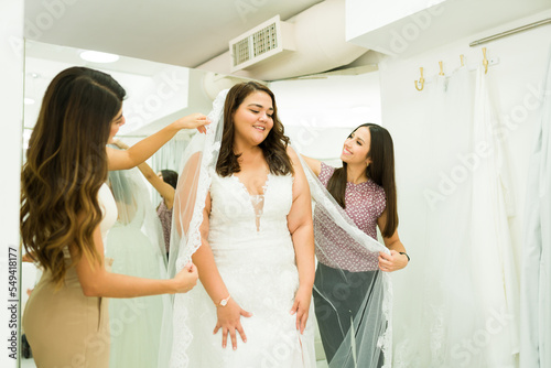 Gorgeous fat woman at the bridal store dressing room