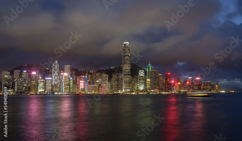 Night landscape / skyline of Hong Kong Harbour, showing neon-lit skyscrapers.