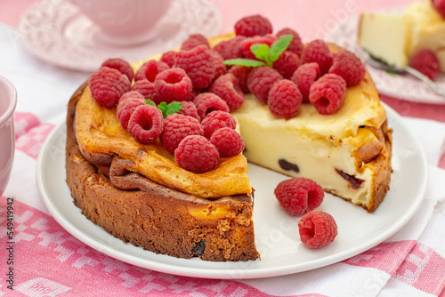 Quark and mascarpone crustless cheesecake served with raspberries