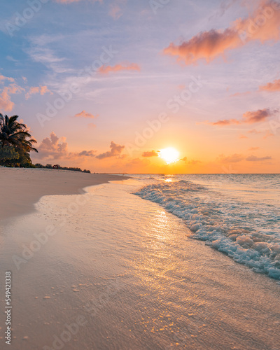 Peaceful nature scenic. Relax paradise, amazing closeup view of calm ocean bay waves with orange sunrise sunset sunlight. Tropical island vacation, holiday beach landscape exotic sea shore coast © icemanphotos
