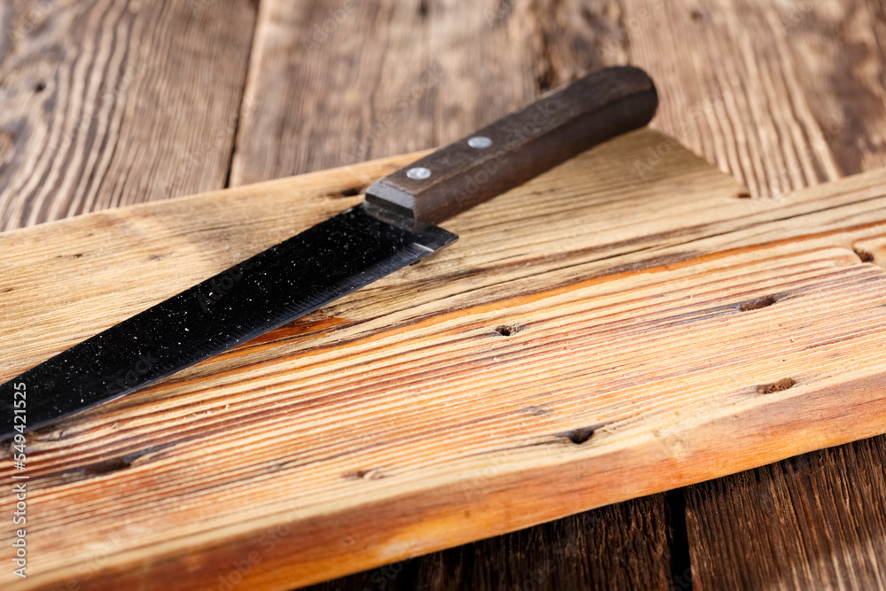 Empty cutting board on wooden table, natural podium for food product.