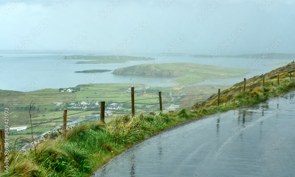narrow country road on a rainy day at the Ring of Kerry, County Kerry, Republic of Ireland