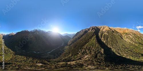 panoramic shot of a mountain range in summer on a sunny cloudless day. bare rocky cliffs