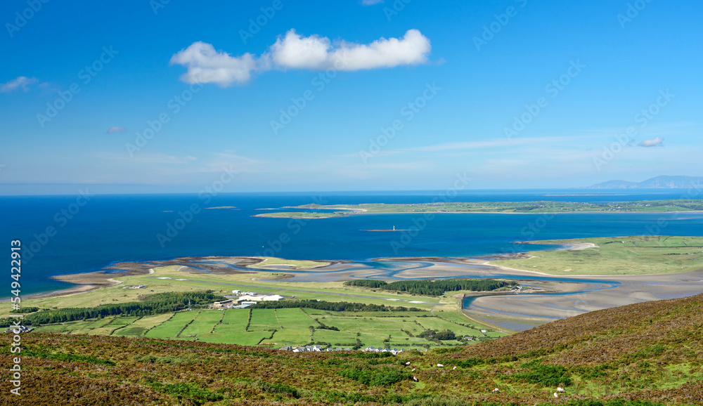 panoramic view from Knocknarea mountain over land and seascape of County Sligo, Republic of Ireland
