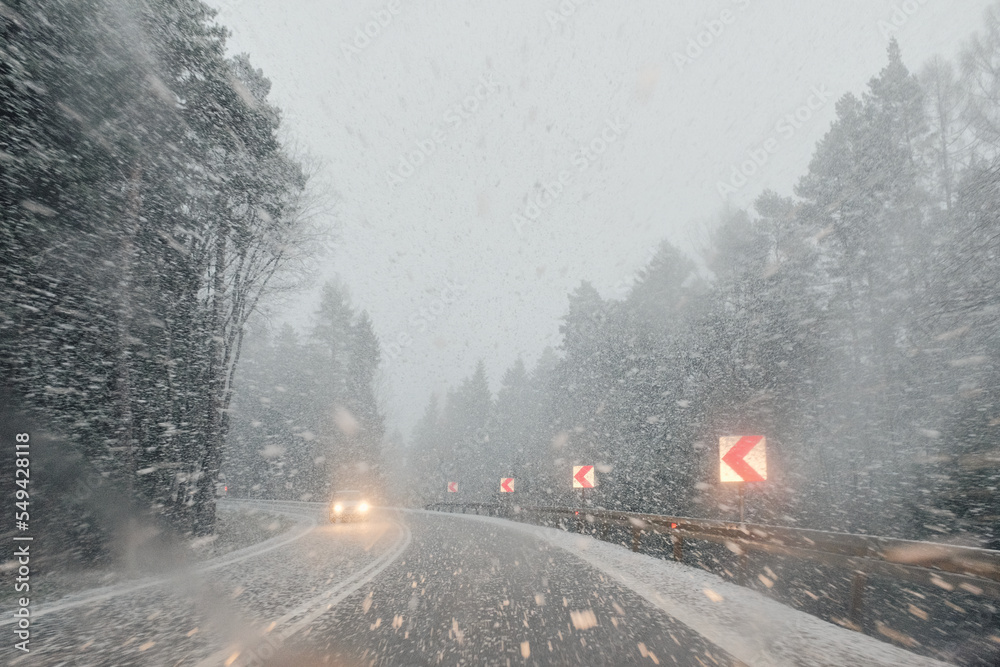 Snowy moody road in the mountains, Poland