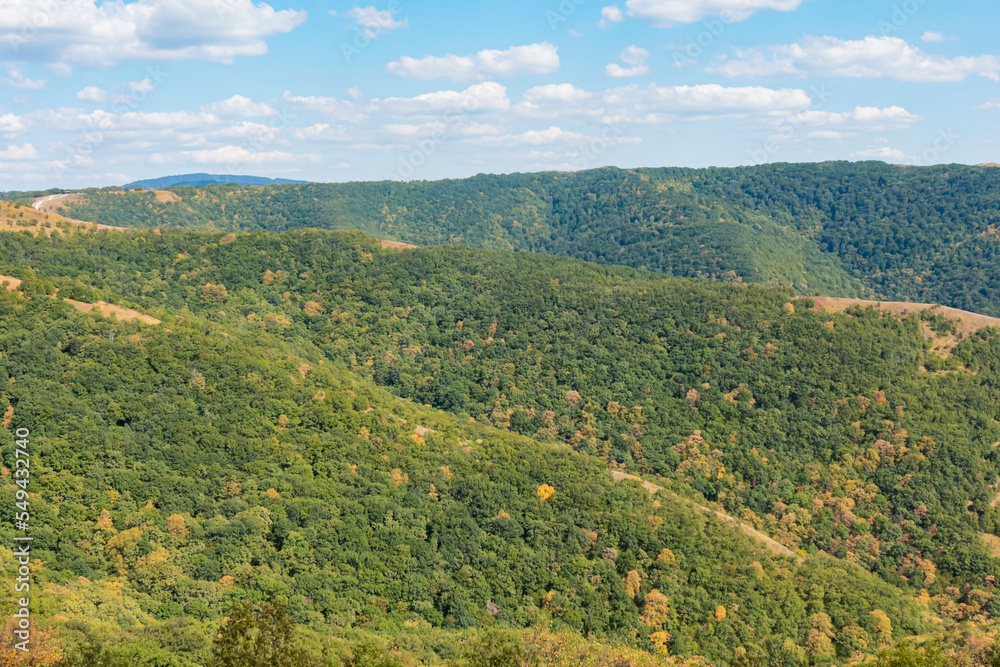 Obraz premium mountain ranges are green and yellow in daylight