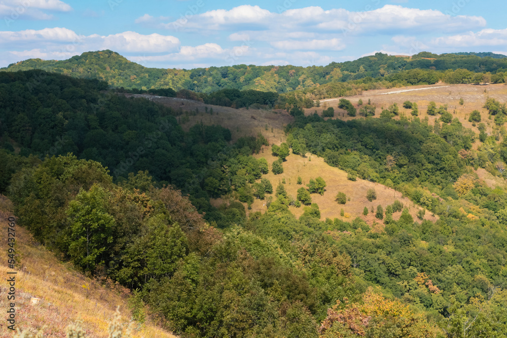 Obraz premium mountain ranges are green and yellow in daylight