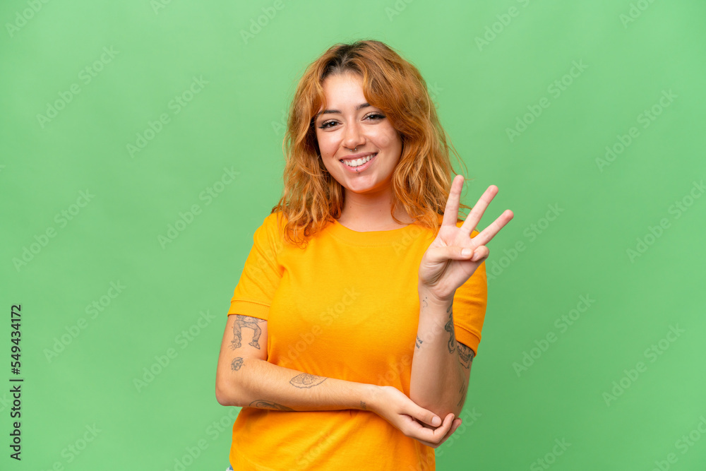 Young caucasian woman isolated on green screen chroma key background happy and counting three with fingers Young caucasian woman isolated on green screen chroma key background happy and counting three with fingers