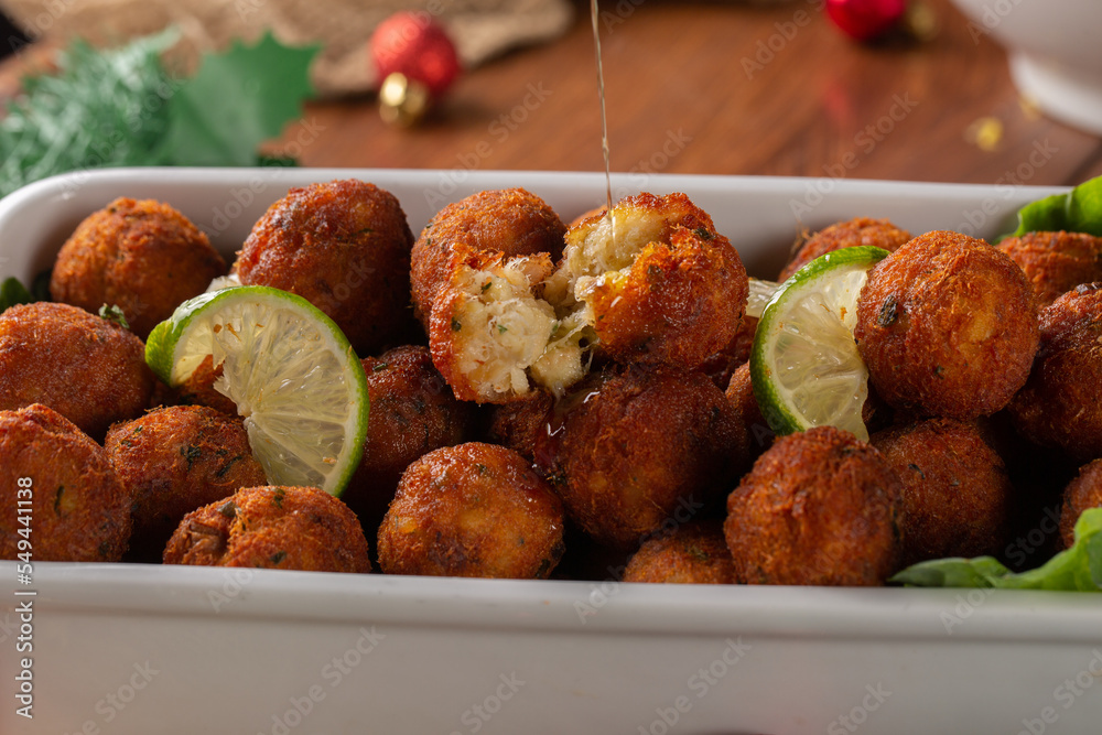 Codfish ball. cod croquette with potato is a traditional Portuguese dish.  in Brazil called bolinho de bacalhau. Served at Christmas Dinner Stock  Photo | Adobe Stock