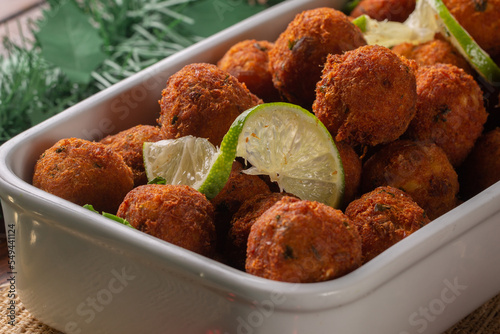 Codfish ball. cod croquette with potato is a traditional Portuguese dish. in Brazil called bolinho de bacalhau. Served at Christmas Dinner photo