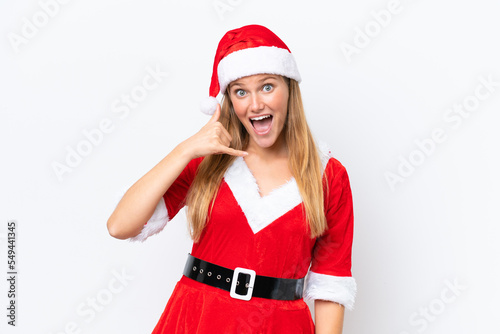 Young caucasian woman dressed as mama noel isolated on white background making phone gesture. Call me back sign