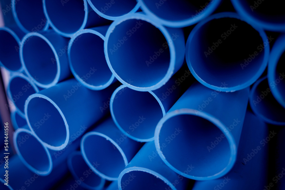 Background of the blue plastic pipes in stacked