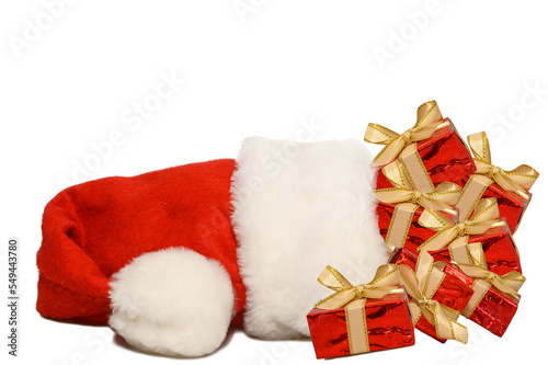 Red santa claus hat isolated on white background. Red gift boxes.