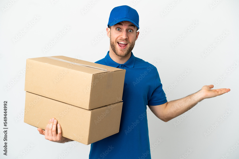 Delivery man over isolated white background with shocked facial expression Delivery man over isolated white background with shocked facial expression
