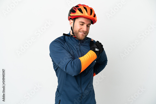 Young cyclist man isolated on white background suffering from pain in shoulder for having made an effort