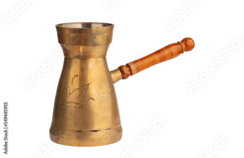 turka, a copper coffee pot with a wooden handle, isolated on a white background