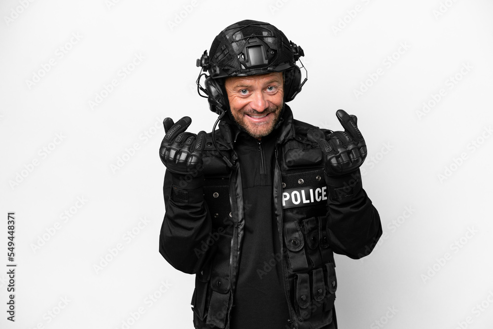 Middle age SWAT man isolated on white background making money gesture Middle age SWAT man isolated on white background making money gesture
