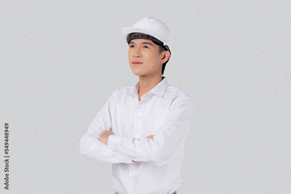 Portrait young asian man is engineer wearing helmet standing and smiling with confident isolated on white background, handsome male is architect or contractor, worker or labor, industrial concept. Portrait young asian man is engineer wearing helmet standing and smiling with confident isolated on white background, handsome male is architect or contractor, worker or labor, industrial concept.