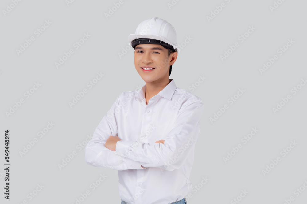 Portrait young asian man is engineer wearing helmet standing and smiling with confident isolated on white background, handsome male is architect or contractor, worker or labor, industrial concept. Portrait young asian man is engineer wearing helmet standing and smiling with confident isolated on white background, handsome male is architect or contractor, worker or labor, industrial concept.