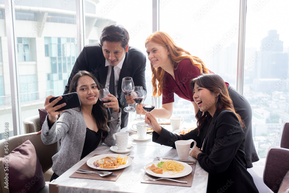 Happy team young business people in party celebrate success selfie taking a photo with friends together at restaurant, friendship and social colleague, meet friends and community concept.