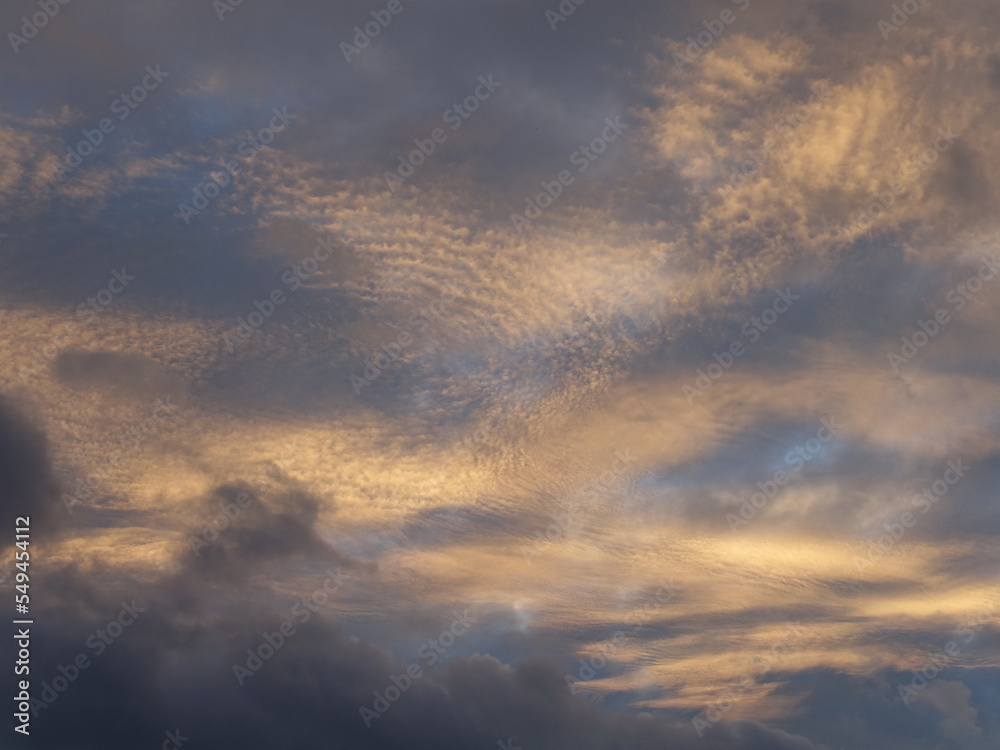 Fototapeta premium Clouds in the blue sky before sunset, background and texture